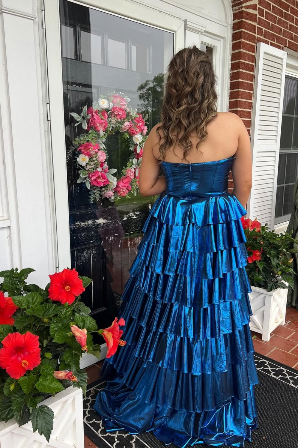 Royal blue metallic strapless A-line tiered plus size prom dress.
