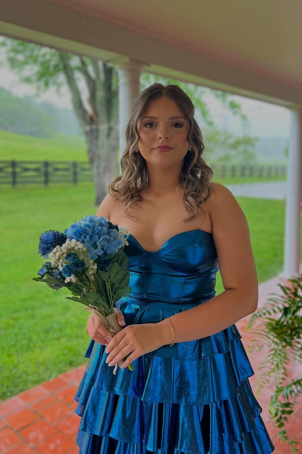 Royal blue metallic strapless A-line tiered plus size prom dress.