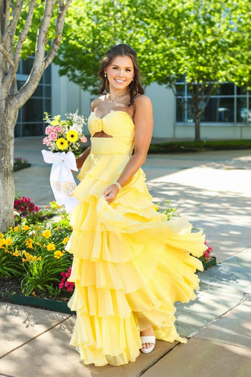 Vibrant yellow sleeveless cut-out bow A-line ruffle prom dress.