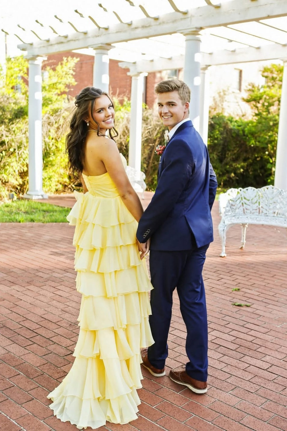 Vibrant yellow sleeveless cut-out bow A-line ruffle prom dress.