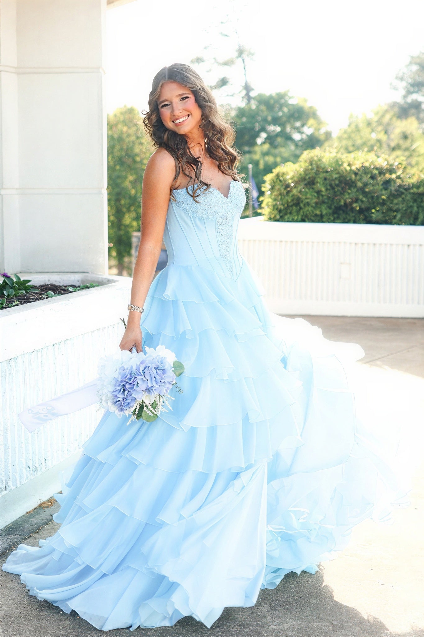V-neck lace appliques corset light blue A-line ruffle prom gown.