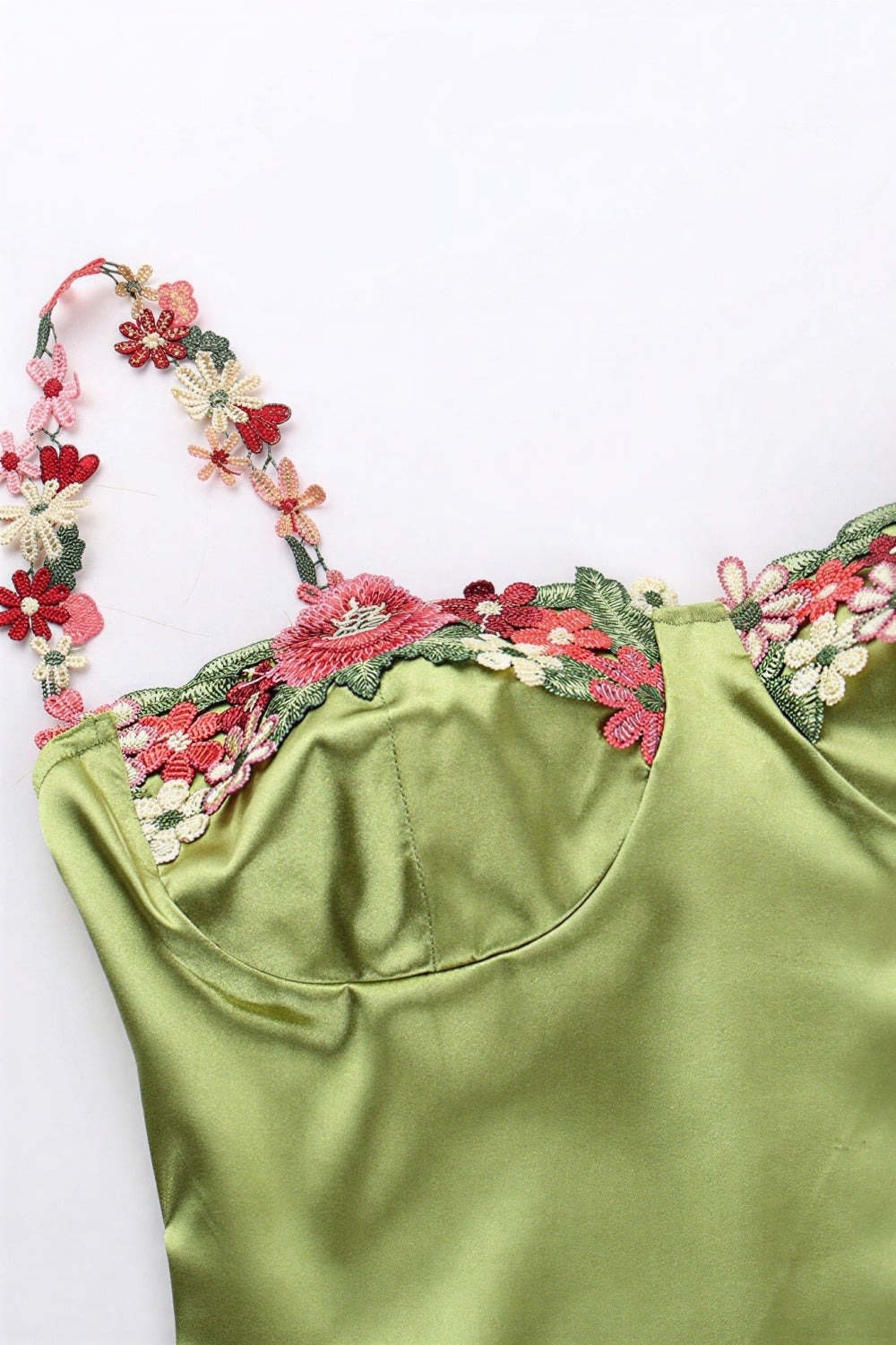 long green bodycon dress with straps and 3d flower embellishments