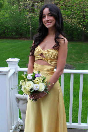 fitted yellow evening gown with twisted chest and keyhole detail