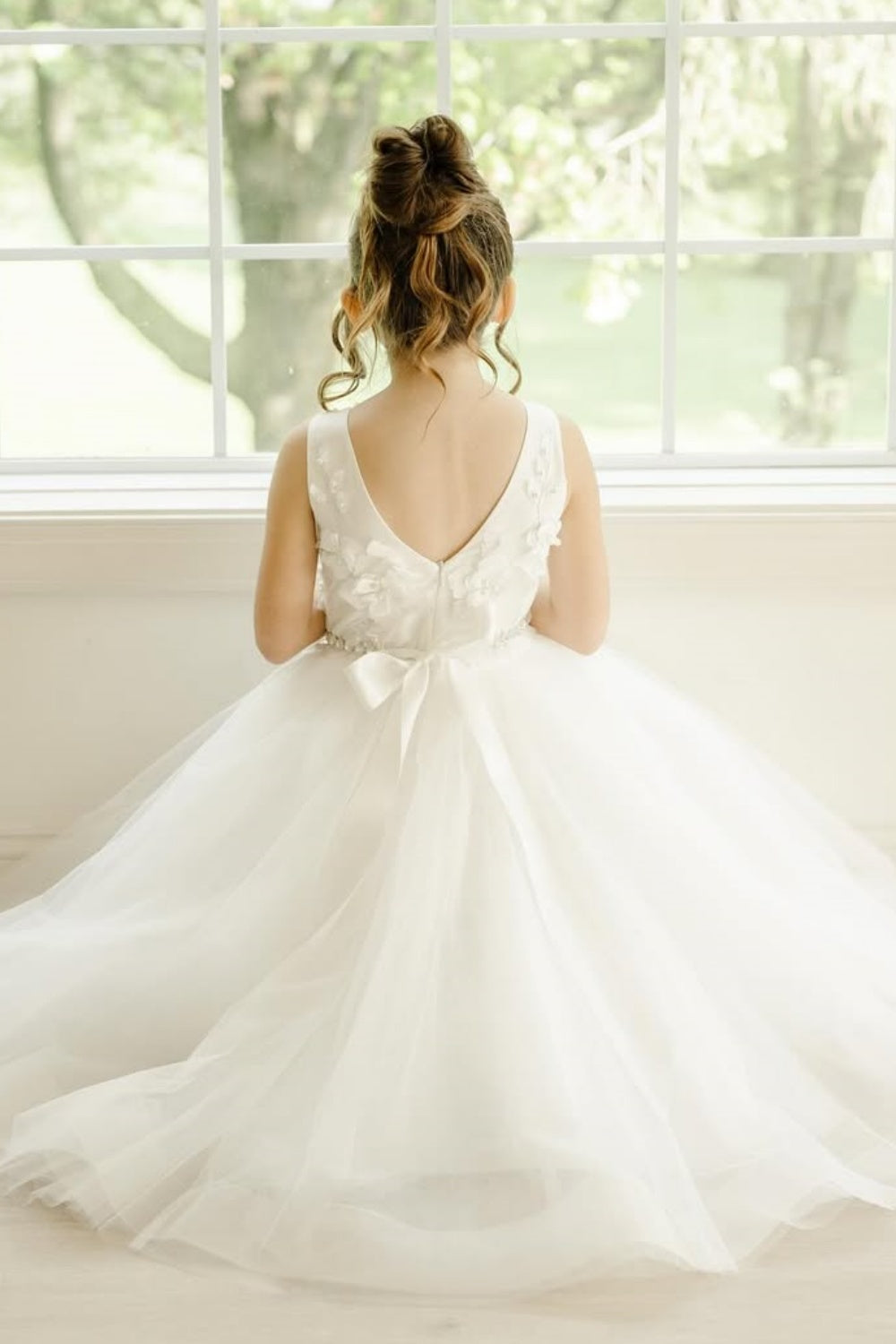 White round neck flower girl dress with 3D floral appliques and diamond accents.
