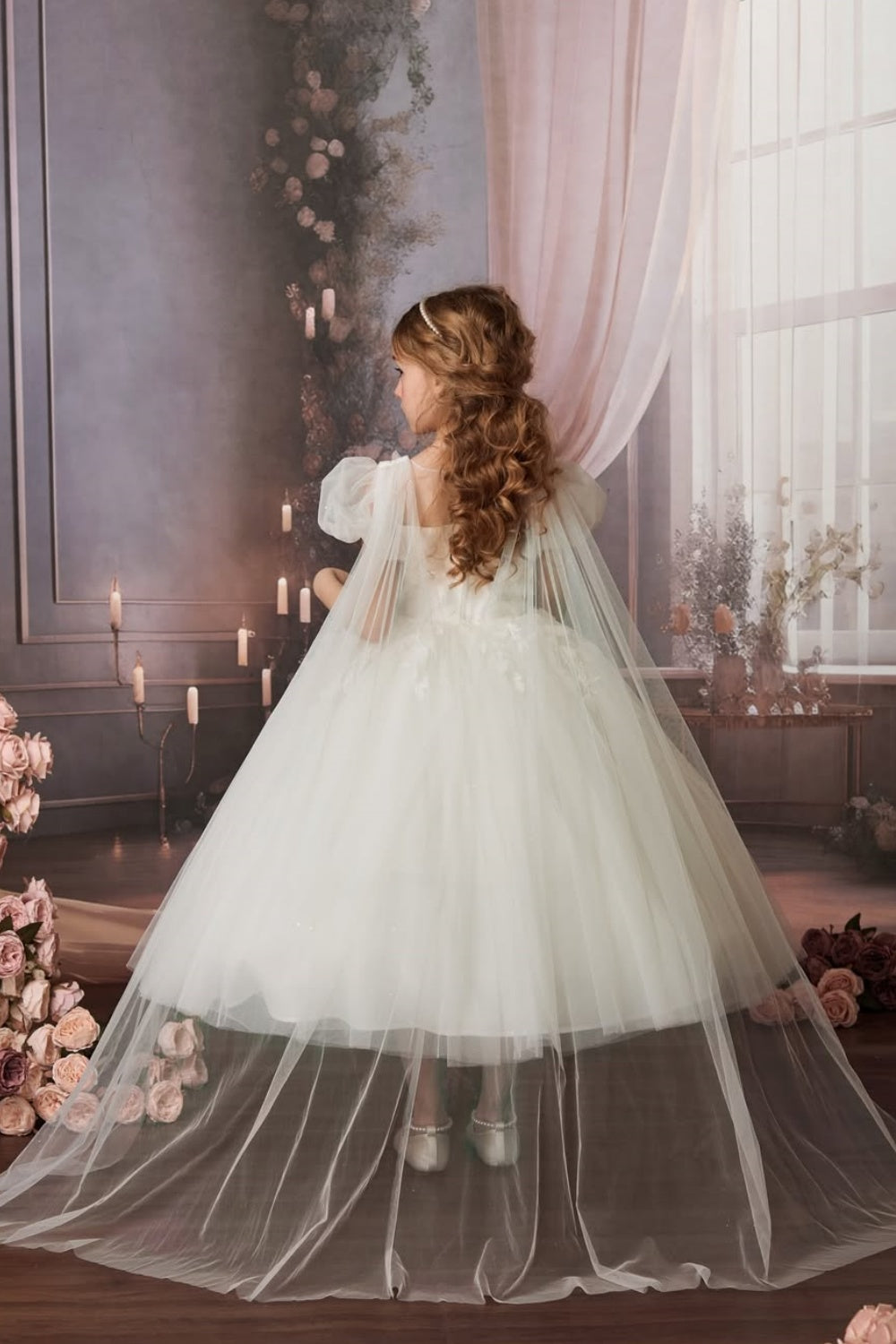 White A-line tulle flower girl dress with 3D floral appliques and cape train.