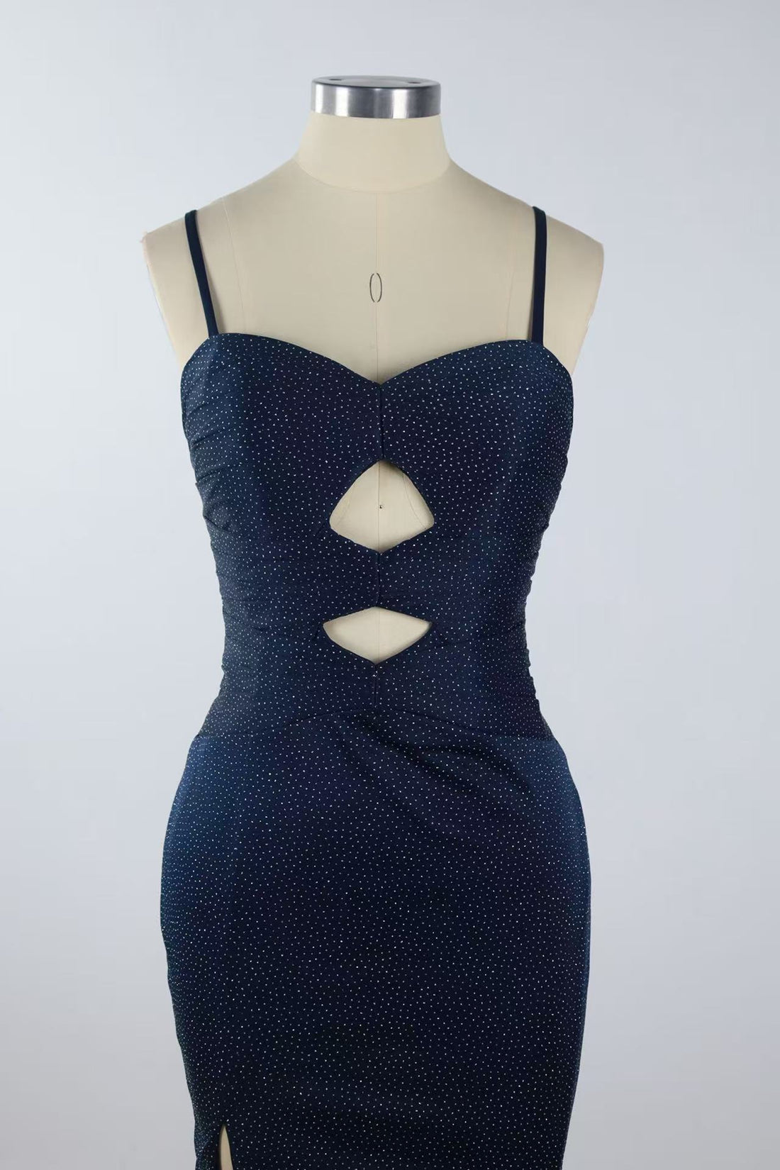 Beaded mermaid prom dress with spaghetti straps, keyhole detail, and side slit.