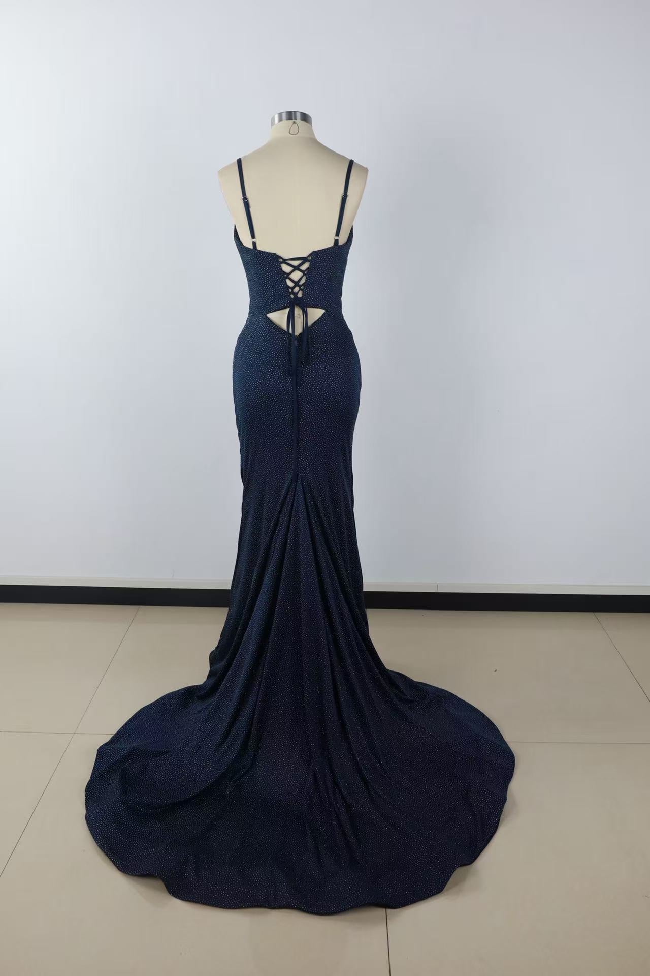 Beaded mermaid prom dress with spaghetti straps, keyhole detail, and side slit.